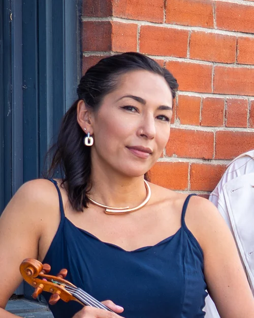 Adrienne Short holding her violin